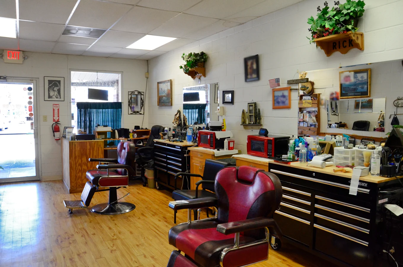 Interior of Rick's Flattop Shop with classic barber chairs and stations